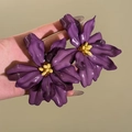 Macro shot of purple floral tassel earrings with yellow stamen on silver pins - Purple 3D Flower Style (15#)