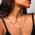 Double-layered golden snake chain necklace worn by a model on a minimalist grey background - Pull-out Style (110cm) / Gold