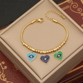 Bracciale a serpente dorato con ciondoli a cuore colorati e dettaglio malocchio su cofanetto - Stile Cuore Occhio del Diavolo (1#)