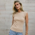 Slim fit beige ribbed knit sleeveless tank top for women in street style outdoor shot - Apricot
