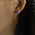 Minimalist round ball stud earring in deep blue color shown on female ear lobe - 5mm / Dark Blue