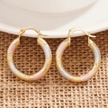 Macro shot of triple-tone hoop earrings with spiral texture in gold, silver, and rose gold - Three Colors
