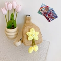 Handwoven straw crossbody bag for kids featuring a bright yellow sunflower decoration - Yellow Floral