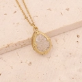 Close-up of golden teardrop necklace with ice-crack crystal on natural stone background - Transparent Ice Crackle Teardrop (8#)