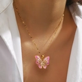 Elegant gold titanium butterfly necklace with pink enamel pendant worn by a model - Pink Butterfly (DJN029GL-RO)