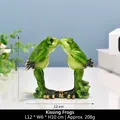 Resin kissing frogs figurine in green with gold details, 12x6x10cm yoga frog decor - Kissing Couple Frogs
