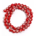 Detail of red Millefiori glass beads with colorful star patterns for DIY jewelry - Red Red Flower