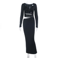 Detail of black long-sleeve crop top and matching floor-length skirt with waist cutout - XS / Black