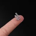 Silver snake cartilage stud with white cubic zirconia and green stone eyes on fingertip - Snake Pave Style (319-8#S)