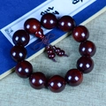 Polished dark red sandalwood prayer beads with traditional knot on antique background - Premium Accessory Style / 20mm*12 Beads