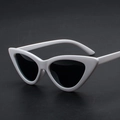 Stylish cat-eye sunglasses with white plastic frame and dark lenses in a 45-degree view - White Frame Black Grey Lens