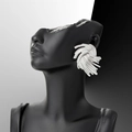 Silver-tone large wheat spike earrings with radial metallic texture on a black model - Large Silver Wheat Ear Studs / Silver