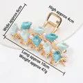 Elegant golden ginkgo leaf hair claw clip with blue enamel and white pearls details - HS02636 Blue