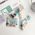 Cute Capybara ID card holder with matching lanyard on minimalist office desk setup - Horizontal Card-Reading