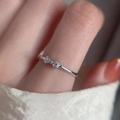 Minimalist silver twist ring featuring a delicate bow tie with small diamond accents - Bowknot Rhinestone Open Ring (J2212)