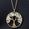 Detail of handmade gold wire-wrapped tree of life pendant with clear crystal stones - Gold + Clear Quartz