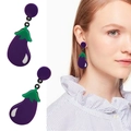 Detailed view of purple eggplant-shaped acrylic drop earrings with glossy finish - Eggplant