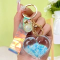 Blue sequin heart liquid keychain with holographic wrist strap and gold metal clasp - Blue