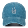 Detailed embroidery of a skull hand with GOOD VIBES text on a washed cotton baseball cap - Adjustable / Lake Blue