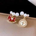 Detail of asymmetrical earrings with red rocking horse and golden cross charm - Gold Asymmetric Red Horse Cross Style (7#)
