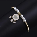 Detail of gold beaded bracelet with evil eye pendant and white heart charms on stand - CB00468 Pearl/Pearl Gold Bead Eye with 3 Hearts
