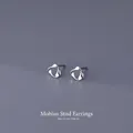 Minimalist S999 sterling silver Mobius stud earrings with polished twisted design - Mobius