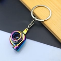 Detailed macro view of a colorful rainbow-plated metal turbocharger shaped keychain accessory - Turbocharger / AB Color