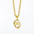 Gold necklace with heart connector and white oval pendant featuring letter W charm - Letter-W