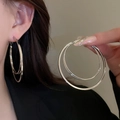 Detailed view of large silver twisted double hoop earrings with a polished metallic finish - Large Silver Double Hoop Style (86#)
