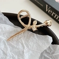 Elegant gold-plated metal rose hair claw clip featuring intricate thorn and leaf detailing - Rose Bud and Stem Style / Medium / Gold