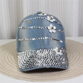 Detailed close-up of blue denim baseball cap with silver rhinestones and white 3D flowers - No.5/Light Blue Denim/White 3D Flowers