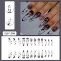 Black graffiti cartoon eyes stiletto press-on nails with abstract ink art patterns - CJCY-200 Black Anime Eyes Style