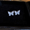 Detailed close-up of butterfly stud earrings with ice-crystal texture on dark background - Butterfly (No.2)