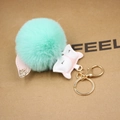 Detail of mint green faux fur fox pompom keychain with gold glitter ears and lobster clasp - Mint Green