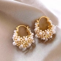 Detailed shot of gold hoop earrings with white pearls on elegant champagne silk fabric - 11# Gold Pearl Inlaid Ear Clip (HE30005)