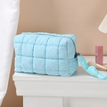 Blue quilted puffer cosmetic bag with knotted zipper pull for travel storage - Octagonal Pouch / Sky Blue