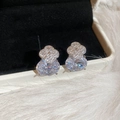 Macro view of silver clover floral earrings with oval zircon stones on black velvet display - Clover Design (Silver Pin - Silver Real Gold Plating)