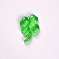 Close-up of a green transparent resin four-leaf clover pendant with fine glitter and loop - Without Eye Hook / Dark Green