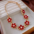 Detail of vintage gold necklace with six red resin flowers and crystal rhinestones center - 37# Necklace-Gold-Red