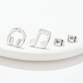 Asymmetric silver music earrings with headphone and musical note studs on white stone - Music Note Silver