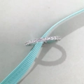 Macro shot of silver S925 ring with sparkling stones and elegant blue ribbon - Size 5 (US 5) / White Zirconia