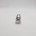 Detailed macro view of silver hollowed-out metal spacer beads for DIY jewelry making - Low Short Cap