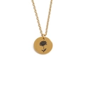 Detailed close-up of golden stainless steel necklace with engraved floral pendant design - November