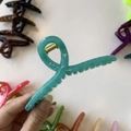 Detail showing high-gloss teal hair claw clip with golden metal spring for thick hair - 11cm / Teal