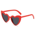 Stylish heart shaped sunglasses featuring a glossy red frame and dark lenses - Kids Red Frame Grey Lens