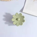 Detail of a matte light green flower hair claw clip on a minimalist white aesthetic backdrop - Matte Light Green