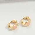 Detailed macro shot of golden star earrings featuring pink smiley face oil drip craftsmanship - Pink Smiley Face / Gold
