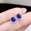 Elegant 925 silver stud earrings with oval blue gemstone and white zircon halo - Sapphire Led-114 Earrings