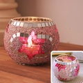 Pink mosaic glass candle holder with star patterns and warm light on wood surface - Pink Hexagonal Flower