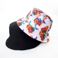 Detail view of cotton tie-dye and black reversible bucket hats with twill fabric texture - Colorful Abstract Vortex